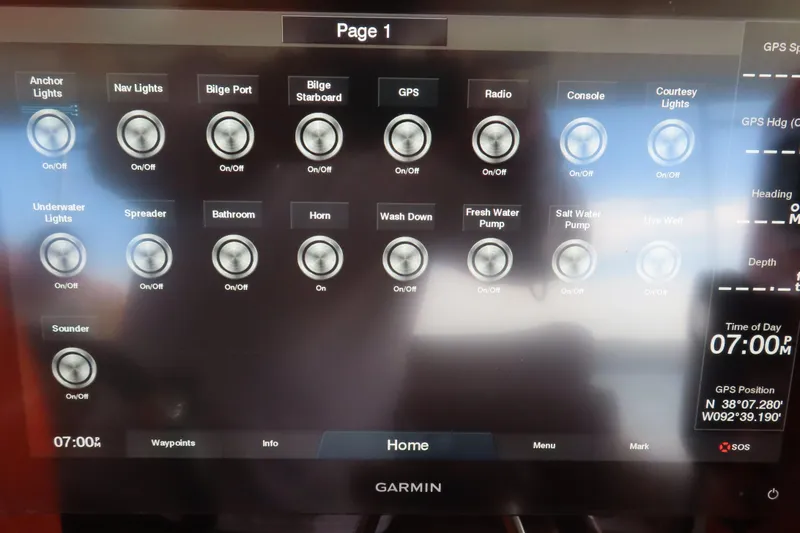 Slide: The Image of Control panel of a 2007 Deep Impact 36 boat with various system switches. - 18