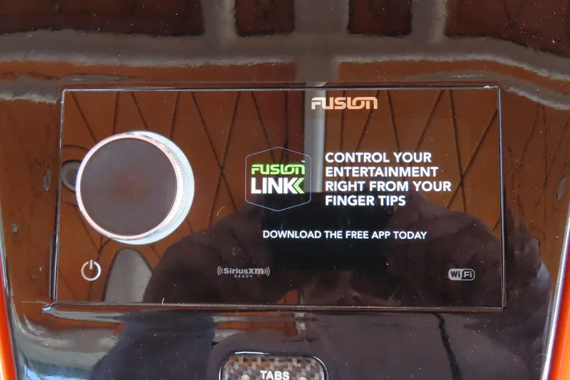 Slide: The Image of Touchscreen display on a 2007 Deep Impact 36 boat, featuring Fusion entertainment controls. - 19