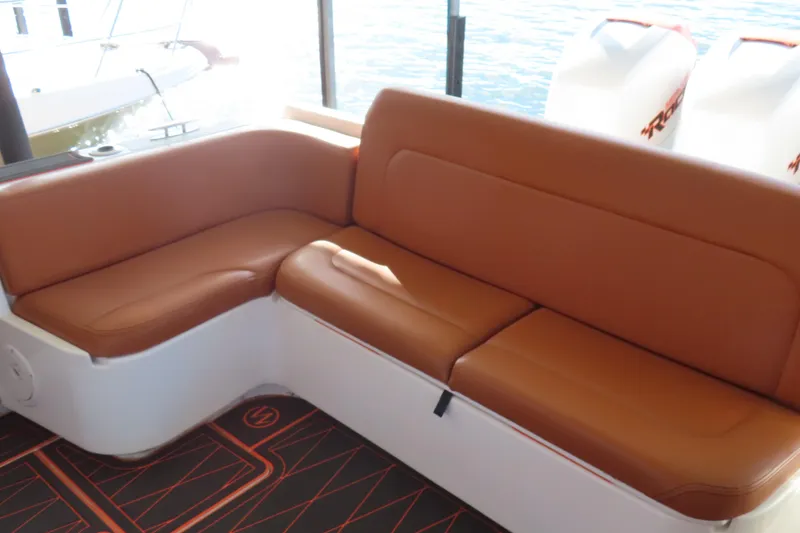 Slide: The Image of Luxury brown leather seating on a 2007 Deep Impact 36 boat, with water view. - 24