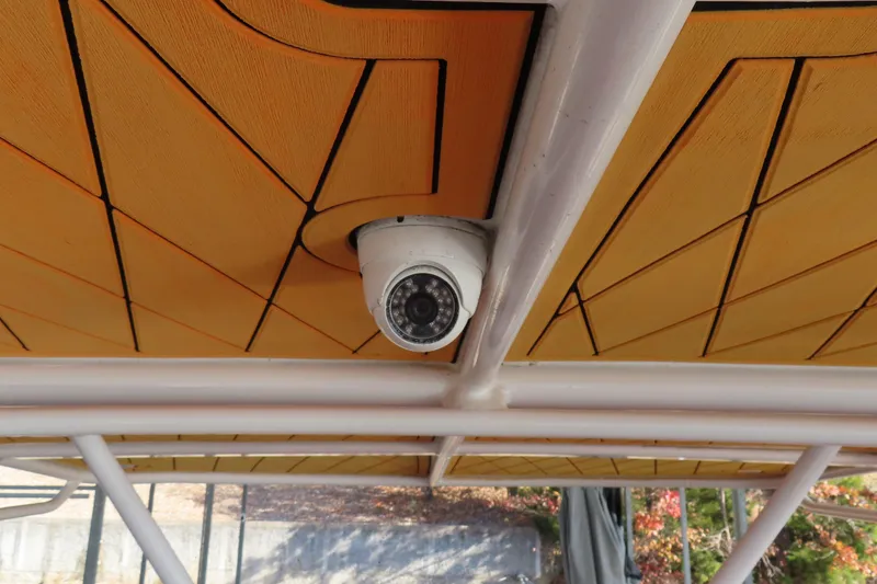 Slide: The Image of Security camera mounted on a 2007 Deep Impact 36 boat's wooden ceiling. - 27