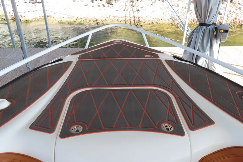 Slide: The Image of Bow deck of 2007 Deep Impact 36 boat with diamond-patterned padding. - 5