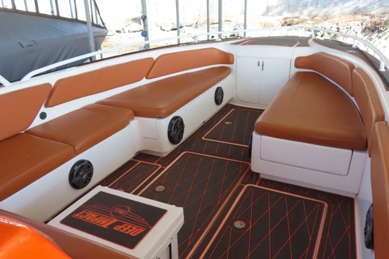 Slide: The Image of 2007 Deep Impact 36 boat interior with brown seating and custom flooring. - 6