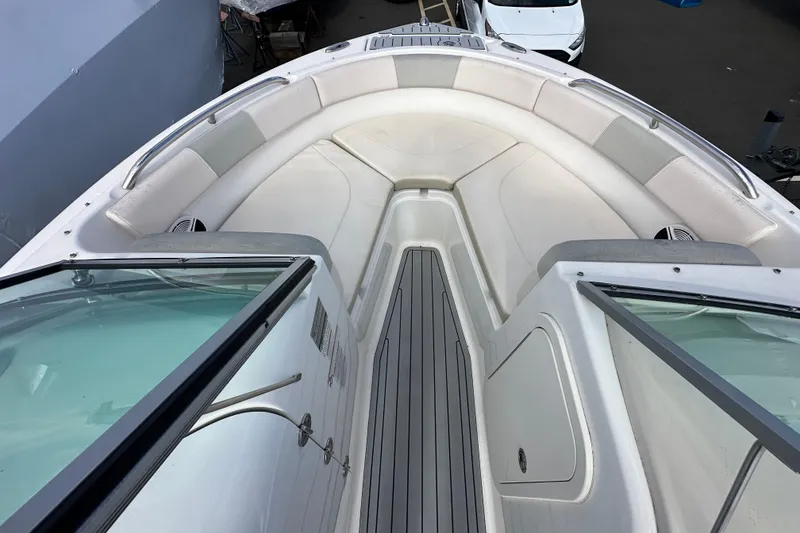 Slide: The Image of 2016 Robalo R227 Dual Console boat interior with white seating and sleek design. - 18