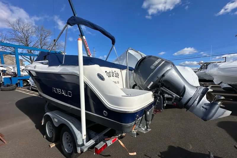 Slide: The Image of 2016 Robalo R227 Dual Console boat on trailer with Yamaha outboard motor. - 3
