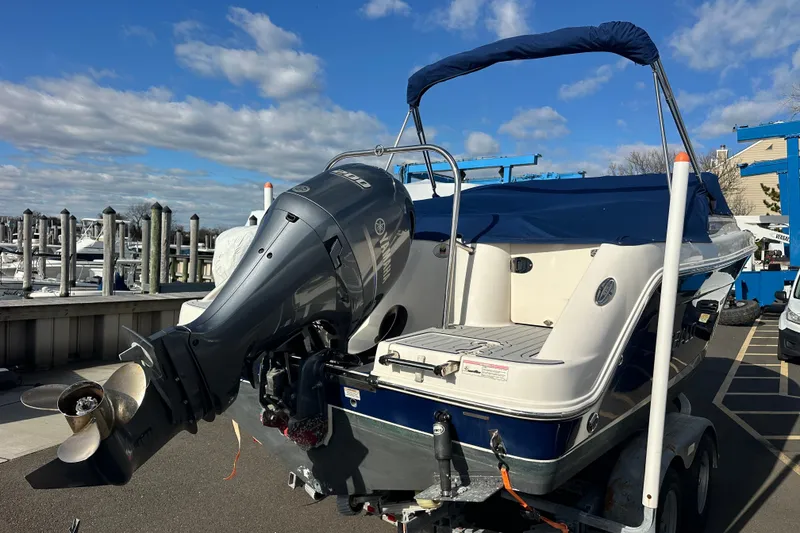 Slide: The Image of 2016 Robalo R227 Dual Console boat with Yamaha outboard motor at marina. - 4