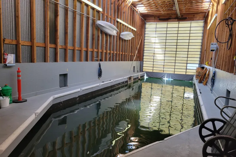 Slide: The Image of Indoor boathouse with water channel, wooden walls, and overhead storage, BoatHouse model, 2005. - 6