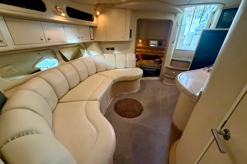 Slide: The Image of Luxurious interior of a 1999 Sea Ray 400 Sundancer yacht with plush seating. - 25
