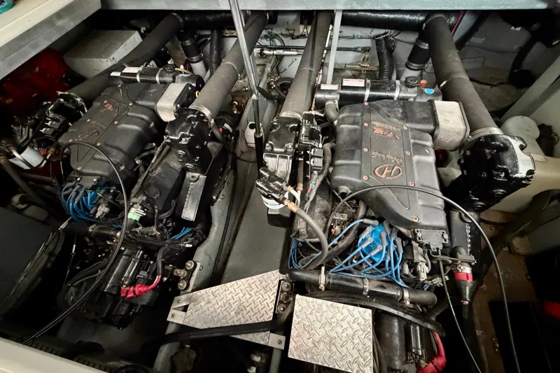 Slide: The Image of Engine room of a 1999 Sea Ray 400 Sundancer with dual engines. - 33
