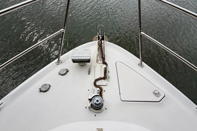 Slide: The Image of Bow of 1999 Sea Ray 400 Sundancer yacht with anchor chain and railing. - 6