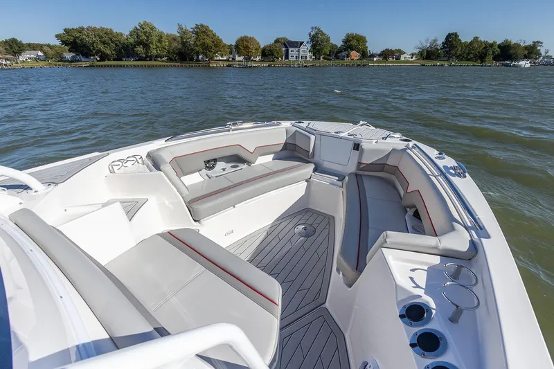 Slide: The Image of Manufacturer Provided Image: 2025 Solara S-250 CW boat interior with spacious seating on a calm lake. - 12