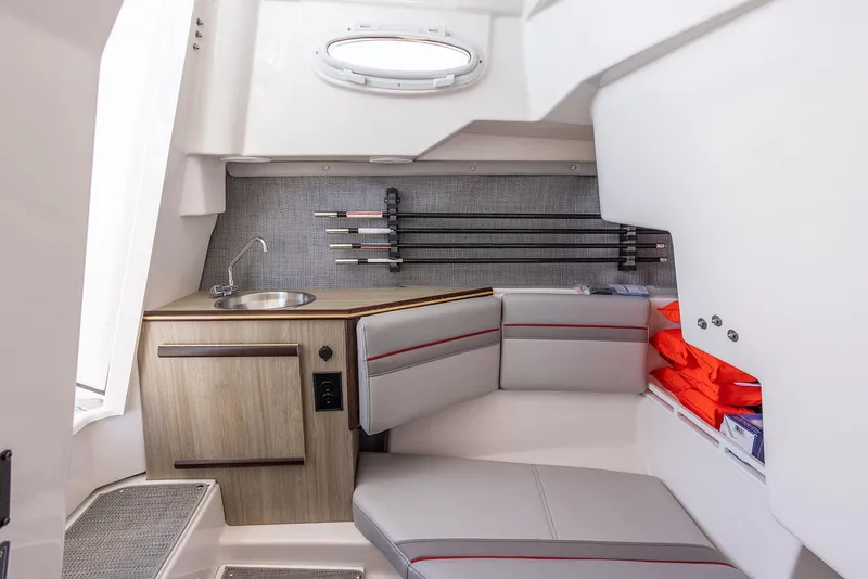 Slide: The Image of Manufacturer Provided Image: Interior of 2025 Solara S-250 CW boat with seating, sink, and storage. - 24