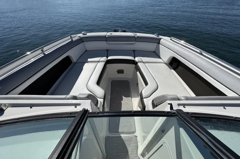 Slide: The Image of 2017 Sea Ray SDX 270 Outboard boat interior with spacious seating on calm water. - 13