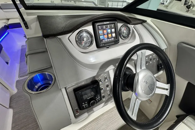 Slide: The Image of 2017 Sea Ray SDX 270 Outboard dashboard with steering wheel and control panel. - 19