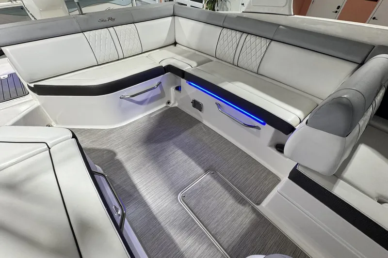 Slide: The Image of 2017 Sea Ray SDX 270 Outboard interior with sleek seating and ambient lighting. - 21