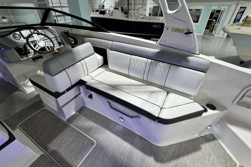 Slide: The Image of 2017 Sea Ray SDX 270 Outboard interior with luxurious seating and modern dashboard. - 22