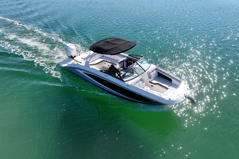 Slide: The Image of 2017 Sea Ray SDX 270 Outboard cruising on sparkling blue water. - 5