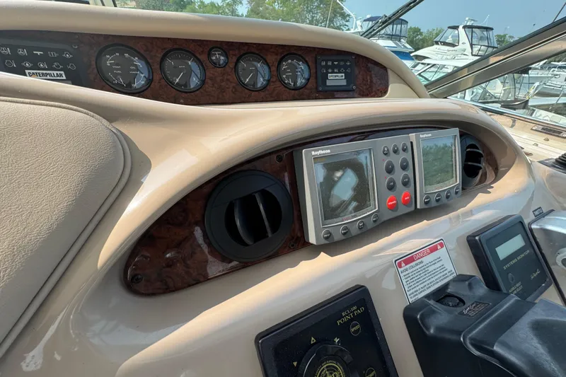 Slide: The Image of 2001 Sea Ray 540 Sundancer helm with navigation instruments and gauges. - 16