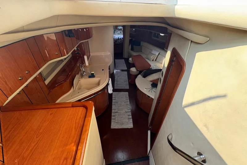 Slide: The Image of Luxurious interior of 2001 Sea Ray 540 Sundancer yacht with elegant wood finishes. - 19