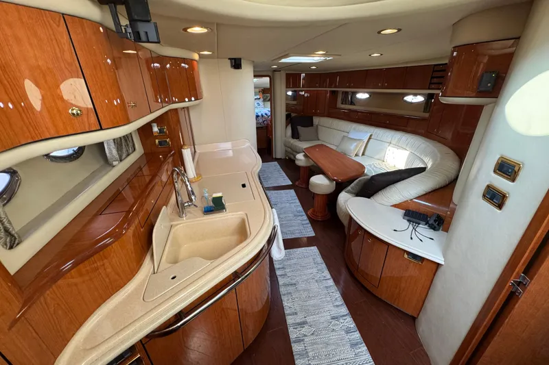 Slide: The Image of Luxurious interior of 2001 Sea Ray 540 Sundancer yacht with elegant wood finishes. - 20