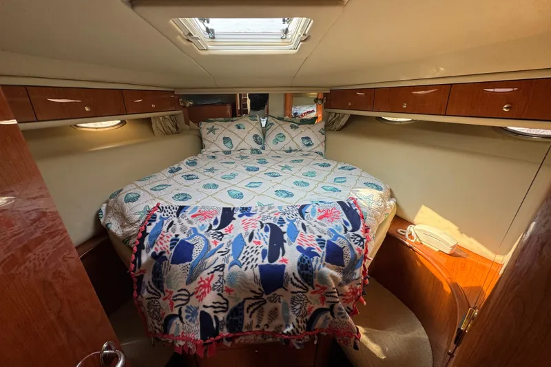 Slide: The Image of Luxurious cabin interior of 2001 Sea Ray 540 Sundancer yacht with cozy bedding. - 28