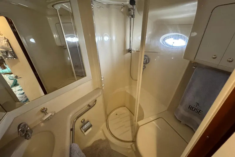 Slide: The Image of Luxurious bathroom in 2001 Sea Ray 540 Sundancer yacht, featuring shower and vanity. - 33