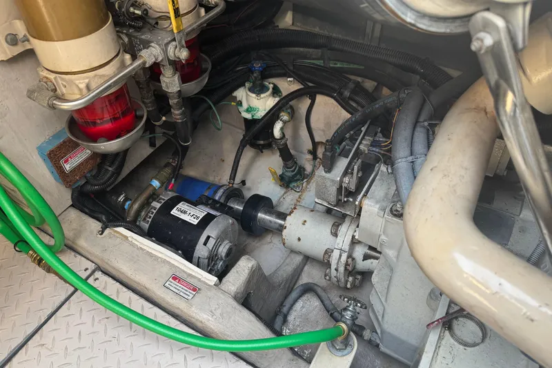 Slide: The Image of Engine compartment of a 2001 Sea Ray 540 Sundancer with visible components and wiring. - 35