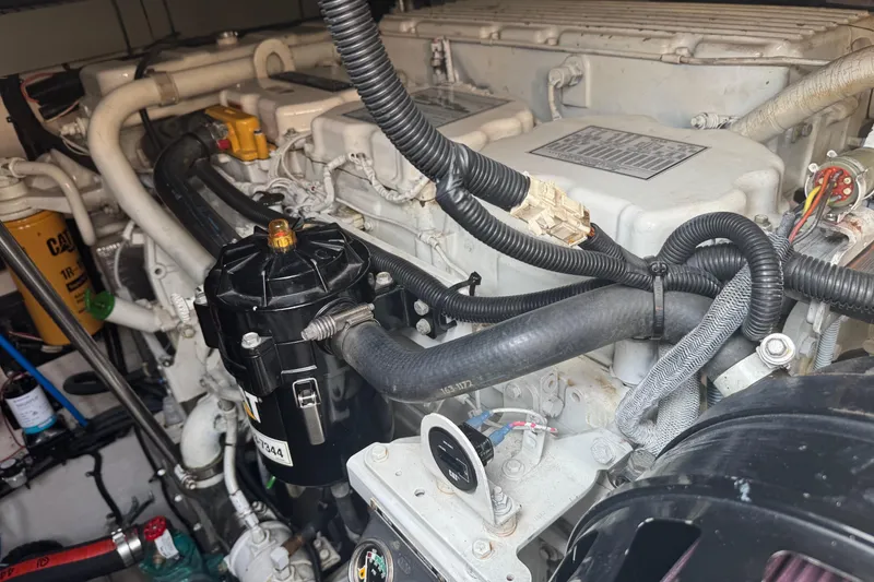 Slide: The Image of Engine compartment of a 2001 Sea Ray 540 Sundancer, showcasing detailed mechanical components. - 37