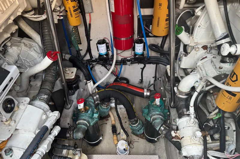 Slide: The Image of Engine room of a 2001 Sea Ray 540 Sundancer with visible components and wiring. - 38