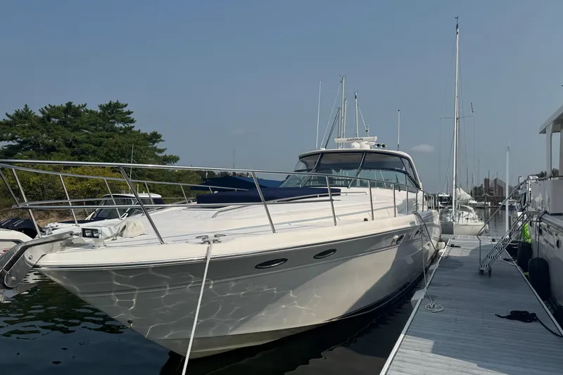 Slide: The Image of 2001 Sea Ray 540 Sundancer yacht docked at marina under clear sky. - 9