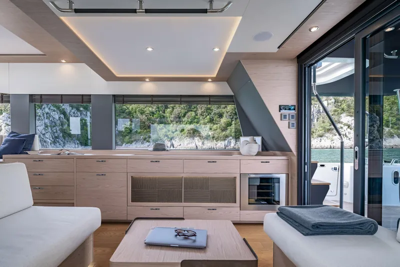 Slide: The Image of Luxurious interior of 2025 Beneteau Grand Trawler 63 with modern design and scenic views. - 19