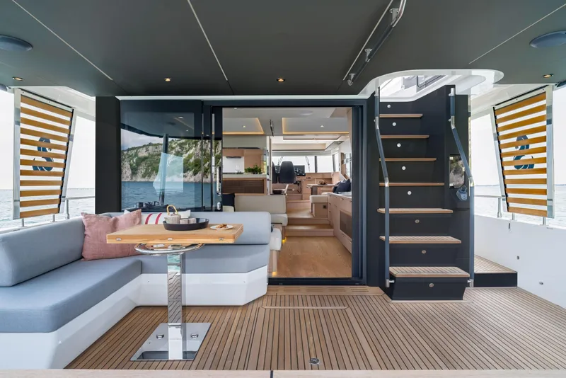 Slide: The Image of Luxurious 2025 Beneteau Grand Trawler 63 yacht interior with elegant seating and modern design. - 8