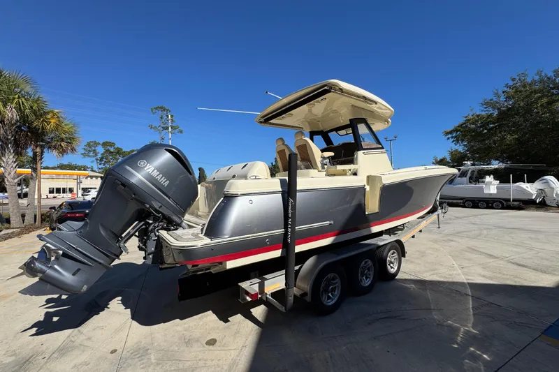 Slide: The Image of 2019 Chris-Craft Catalina 30 boat on trailer with Yamaha outboard motor. - 11
