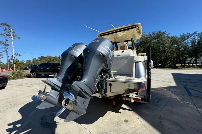 Slide: The Image of 2019 Chris-Craft Catalina 30 with dual Yamaha outboard engines, parked outdoors. - 12
