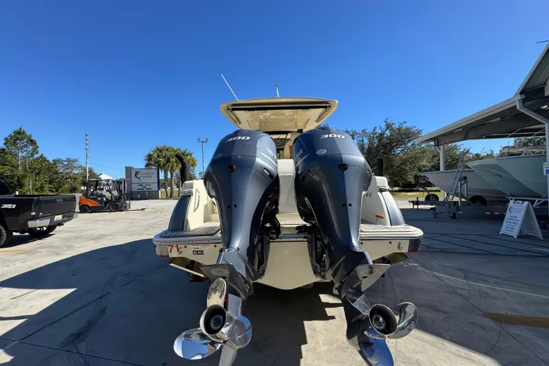 Slide: The Image of 2019 Chris-Craft Catalina 30 with dual 300 HP outboard engines, parked outdoors. - 13