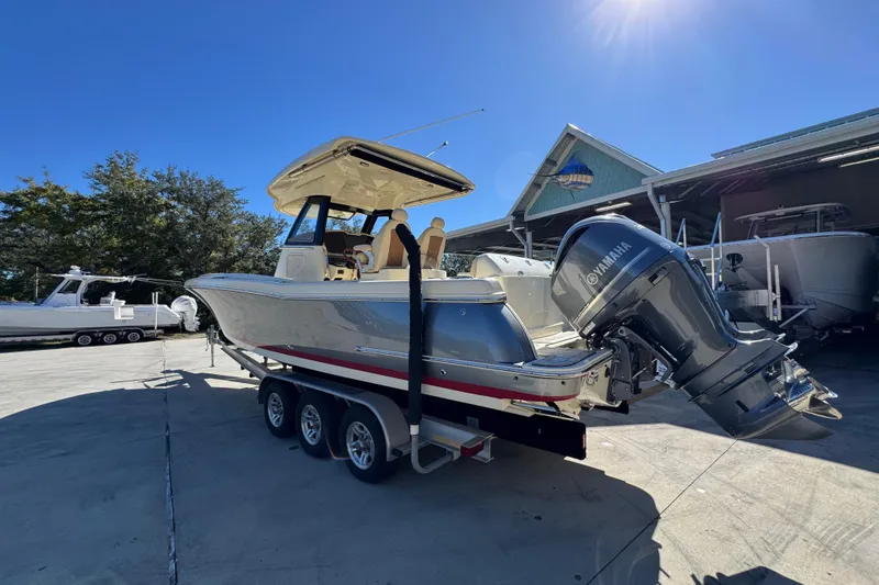 Slide: The Image of 2019 Chris-Craft Catalina 30 boat with Yamaha engine on trailer, sunny day. - 15