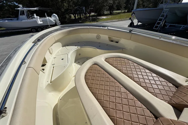 Slide: The Image of 2019 Chris-Craft Catalina 30 boat interior with cushioned seating and elegant design. - 19