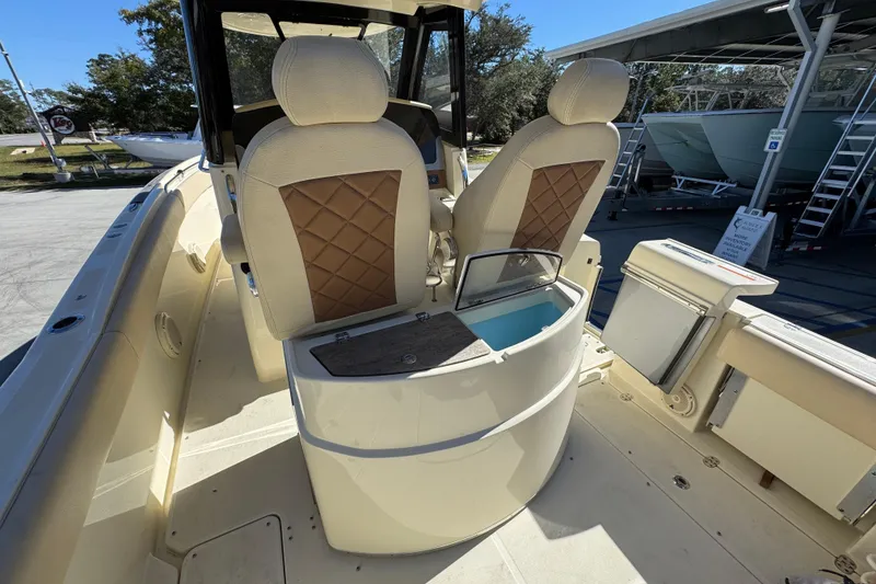 Slide: The Image of 2019 Chris-Craft Catalina 30 interior with seating and storage compartments. - 31