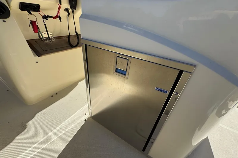 Slide: The Image of 2019 Chris-Craft Catalina 30 interior with stainless steel Isotherm fridge. - 32