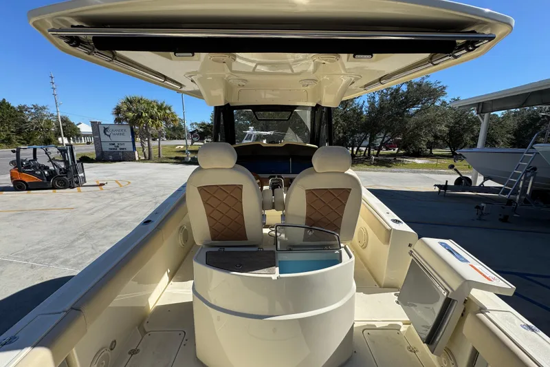 Slide: The Image of 2019 Chris-Craft Catalina 30 boat interior with seating and helm station. - 33