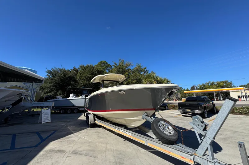 Slide: The Image of 2019 Chris-Craft Catalina 30 boat on trailer under clear blue sky. - 7
