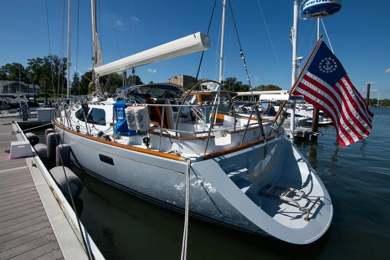 Slide: The Image of Sailboat docked at marina, Morris Ocean Series 45, 2007, with American flag. - 14