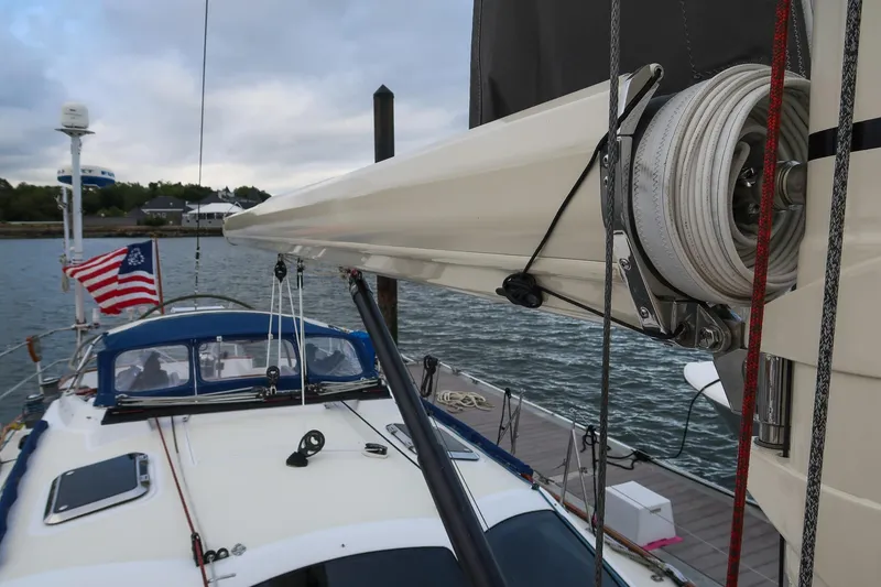 Slide: The Image of Sailboat docked, Morris Ocean Series 45, 2007, with American flag and overcast sky. - 17