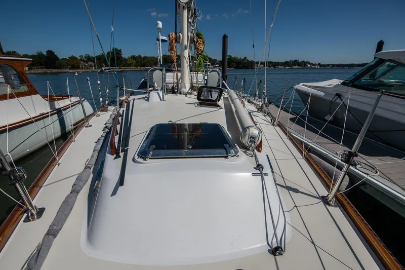 Slide: The Image of 2007 Morris Ocean Series 45 sailboat docked, showcasing deck and rigging under clear blue sky. - 24