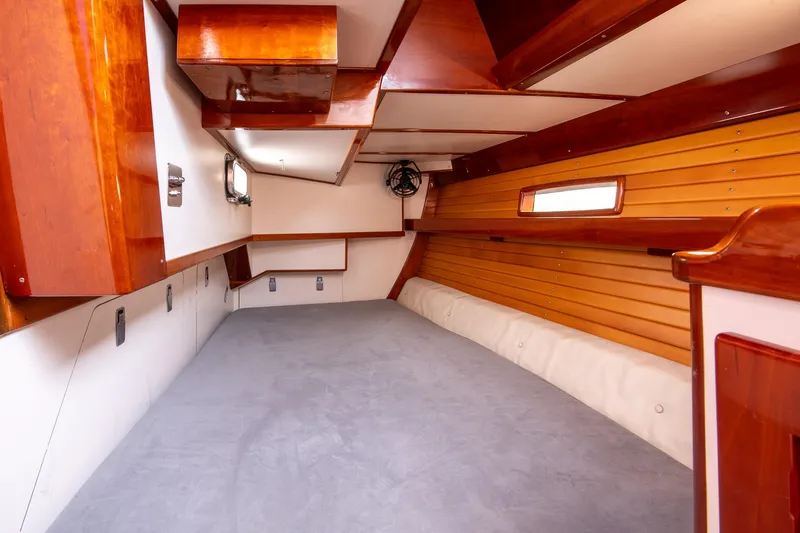 Slide: The Image of Interior of 2007 Morris Ocean Series 45 yacht with wooden finishes and cozy sleeping area. - 36