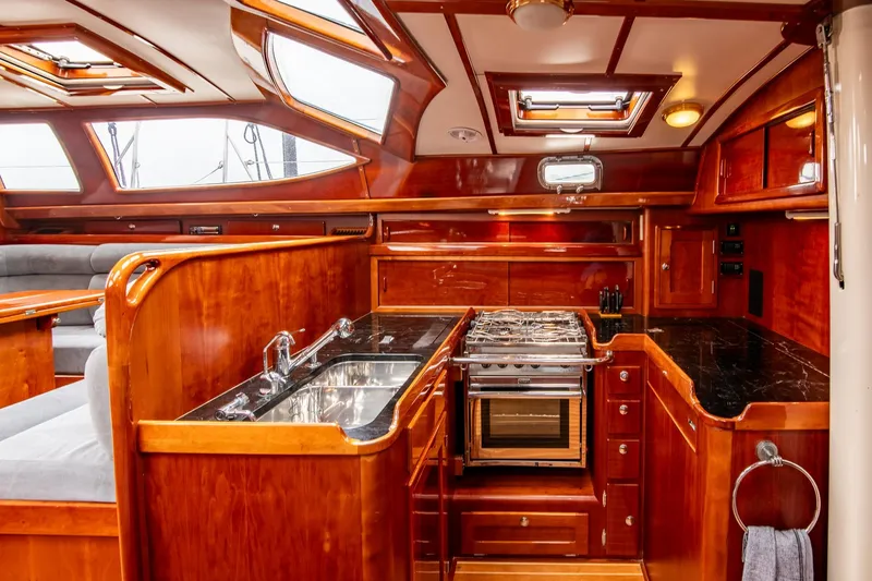 Slide: The Image of Luxurious 2007 Morris Ocean Series 45 yacht interior with elegant wood finish and modern kitchen amenities. - 39