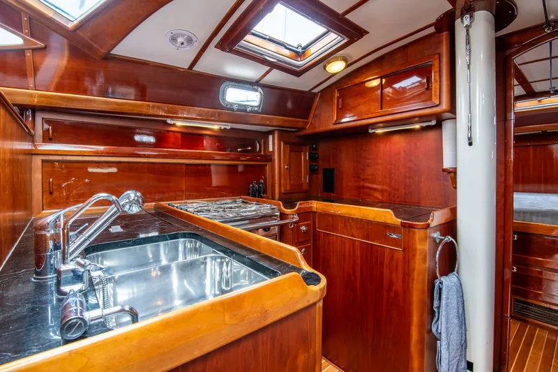 Slide: The Image of Luxurious wooden interior of 2007 Morris Ocean Series 45 yacht kitchen. - 42
