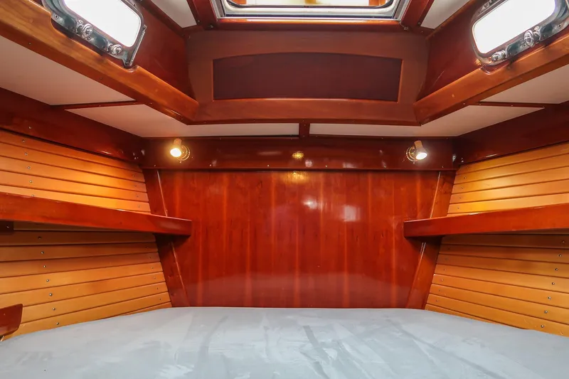 Slide: The Image of Interior of 2007 Morris Ocean Series 45 yacht with polished wood finish and cozy lighting. - 47