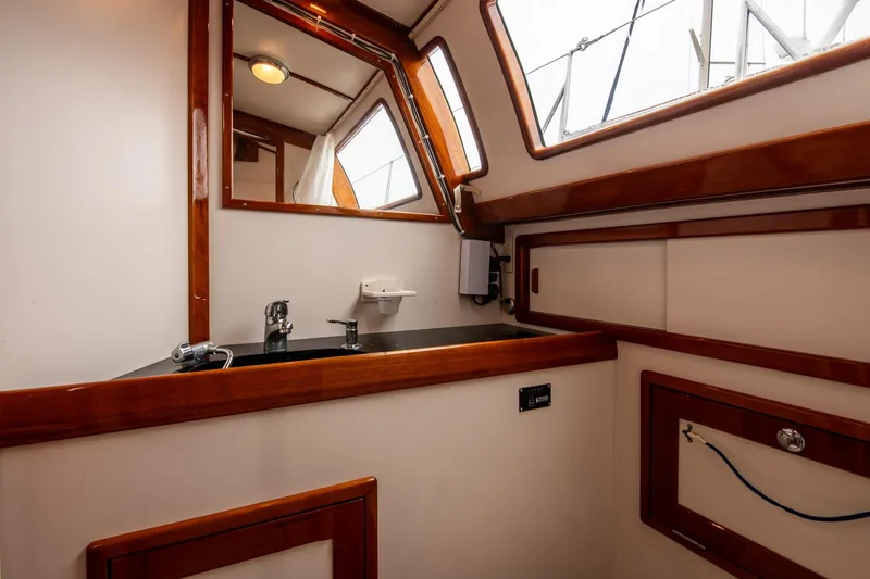 Slide: The Image of Interior of 2007 Morris Ocean Series 45 yacht bathroom with wooden trim and sink. - 51