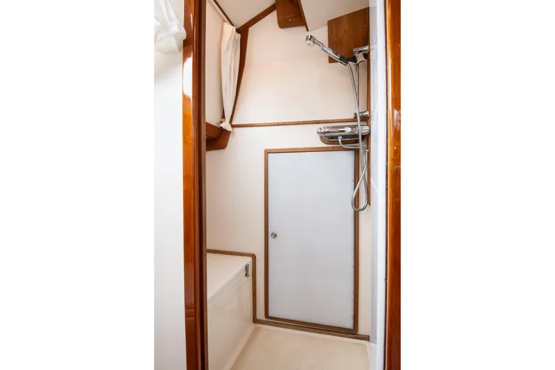 Slide: The Image of Bathroom interior of 2007 Morris Ocean Series 45 yacht, featuring shower and wooden accents. - 52