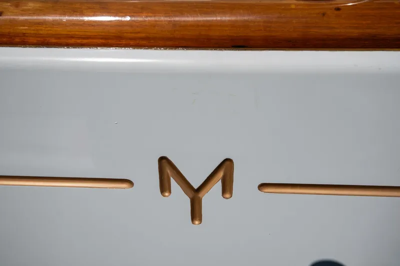 Slide: The Image of Morris Ocean Series 45 emblem on a 2007 model with wooden trim detail. - 55